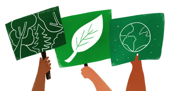 Hands holding signs about climate Drei Hände mit Schildern zum Klima